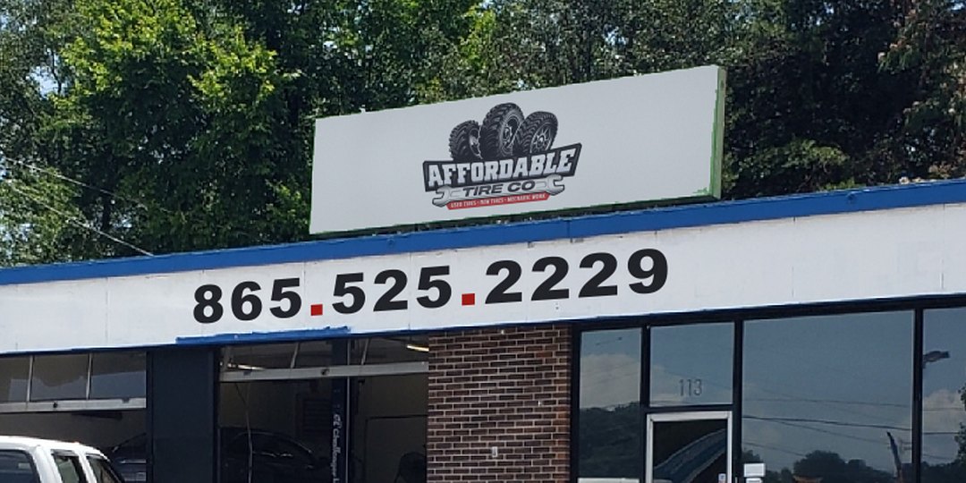 The Affordable Tire Co storefront on Walker Springs Rd in Knoxville, with the service bay open